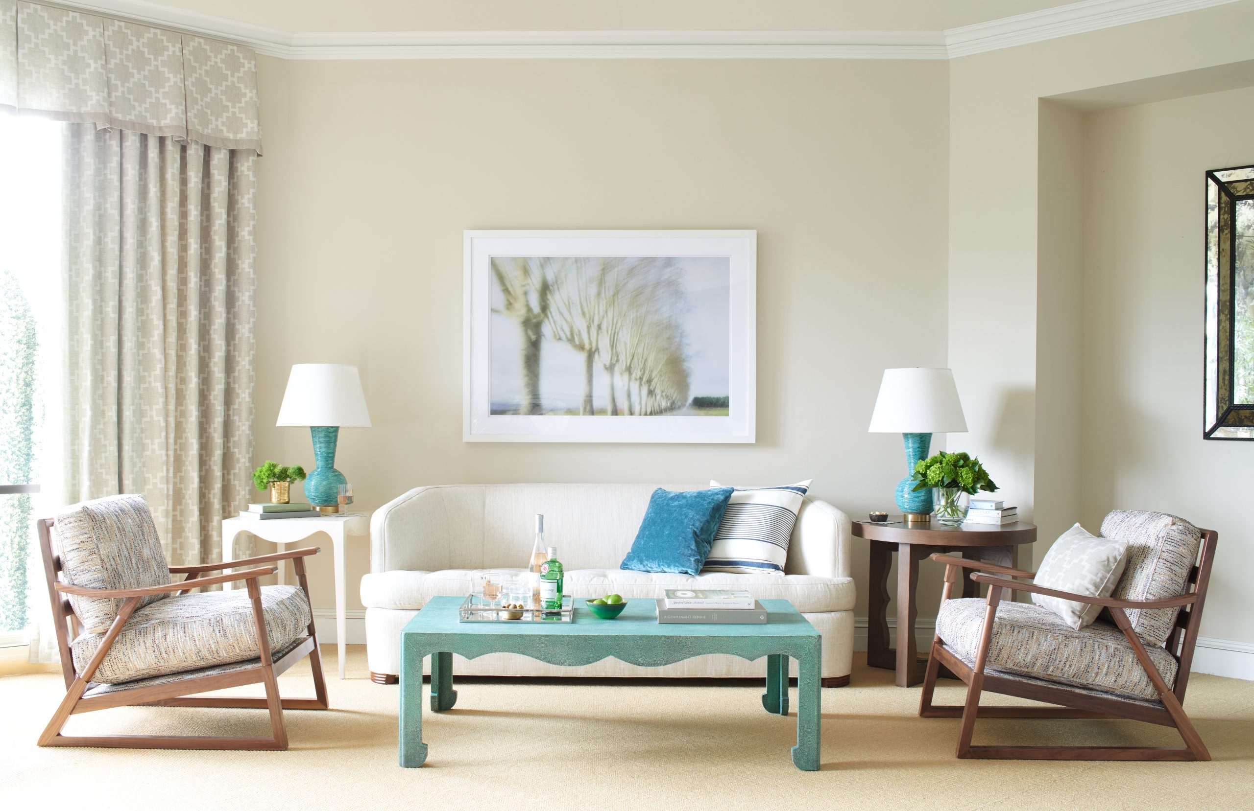 a set of white couch in a living room