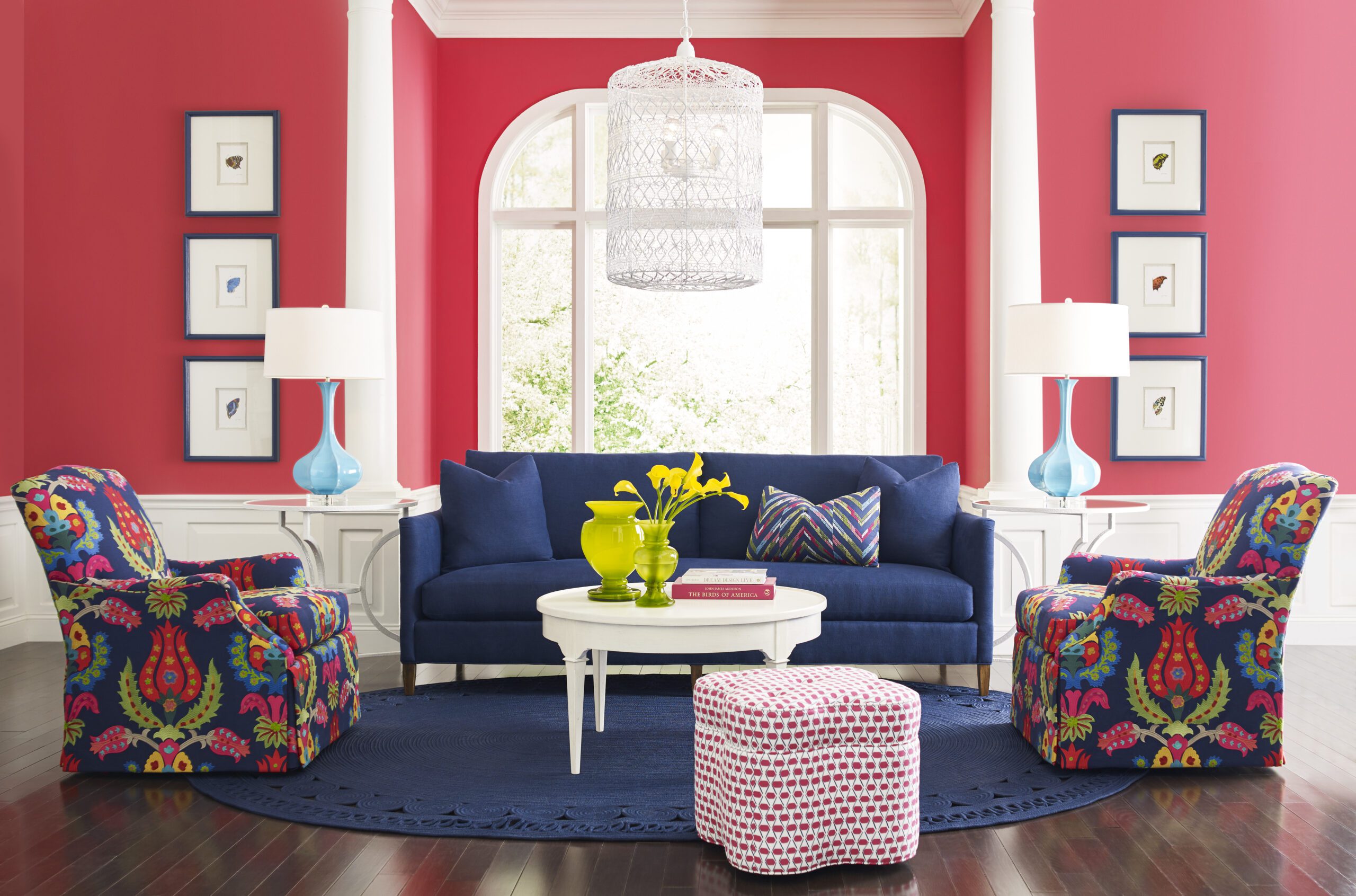 a living room with couches and red walls